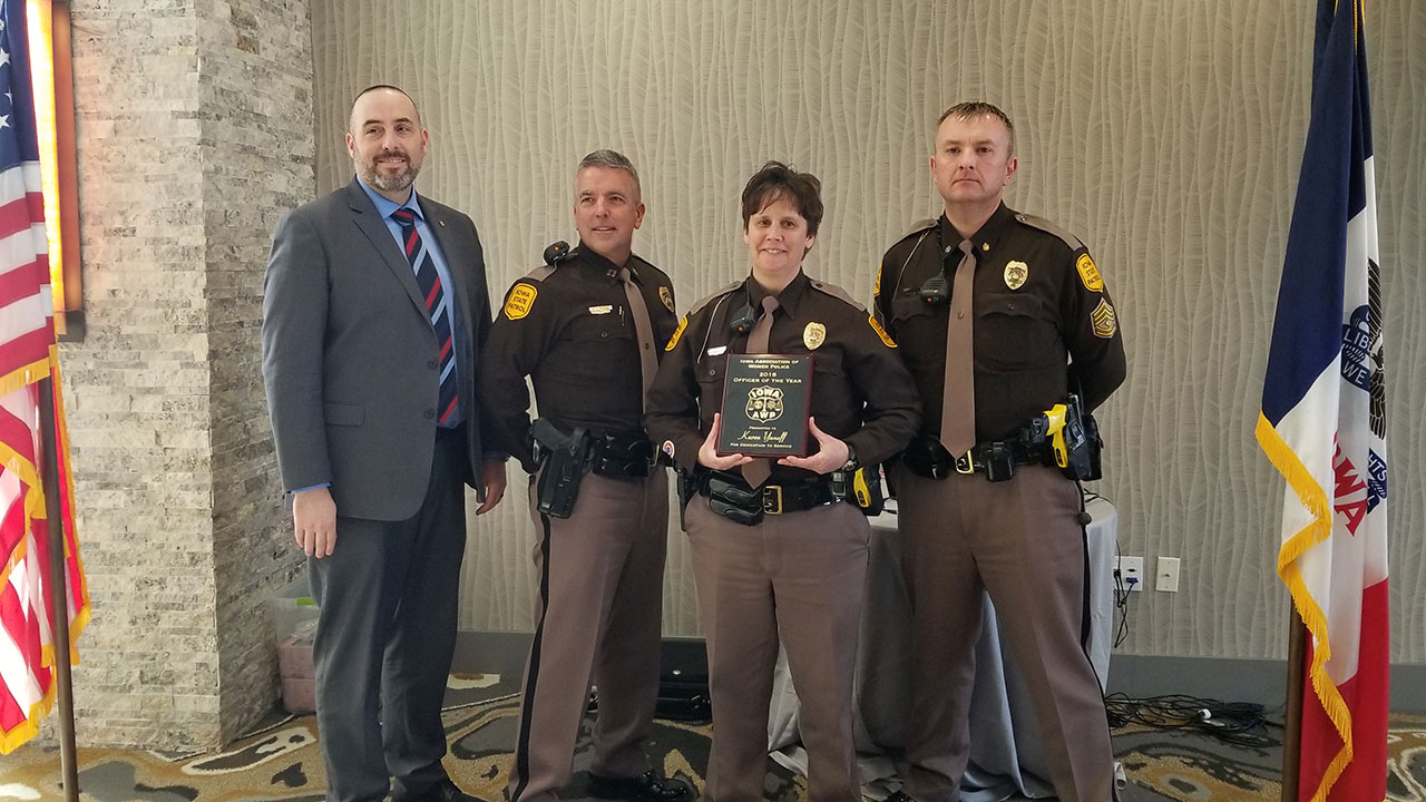 Trooper Karen Yaneff with her Supervisors and Commissioner Stephan Bayens as she is awarded the Iowa Assoc. of Women Police Officer of the Year Award