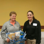 Regina Wolfe picks up a raffle prize at the 2017 Spring Training Conference