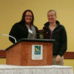 Pres. Andrea Wilson presents Amanda Clark with the 2016 Officer of the Year Award